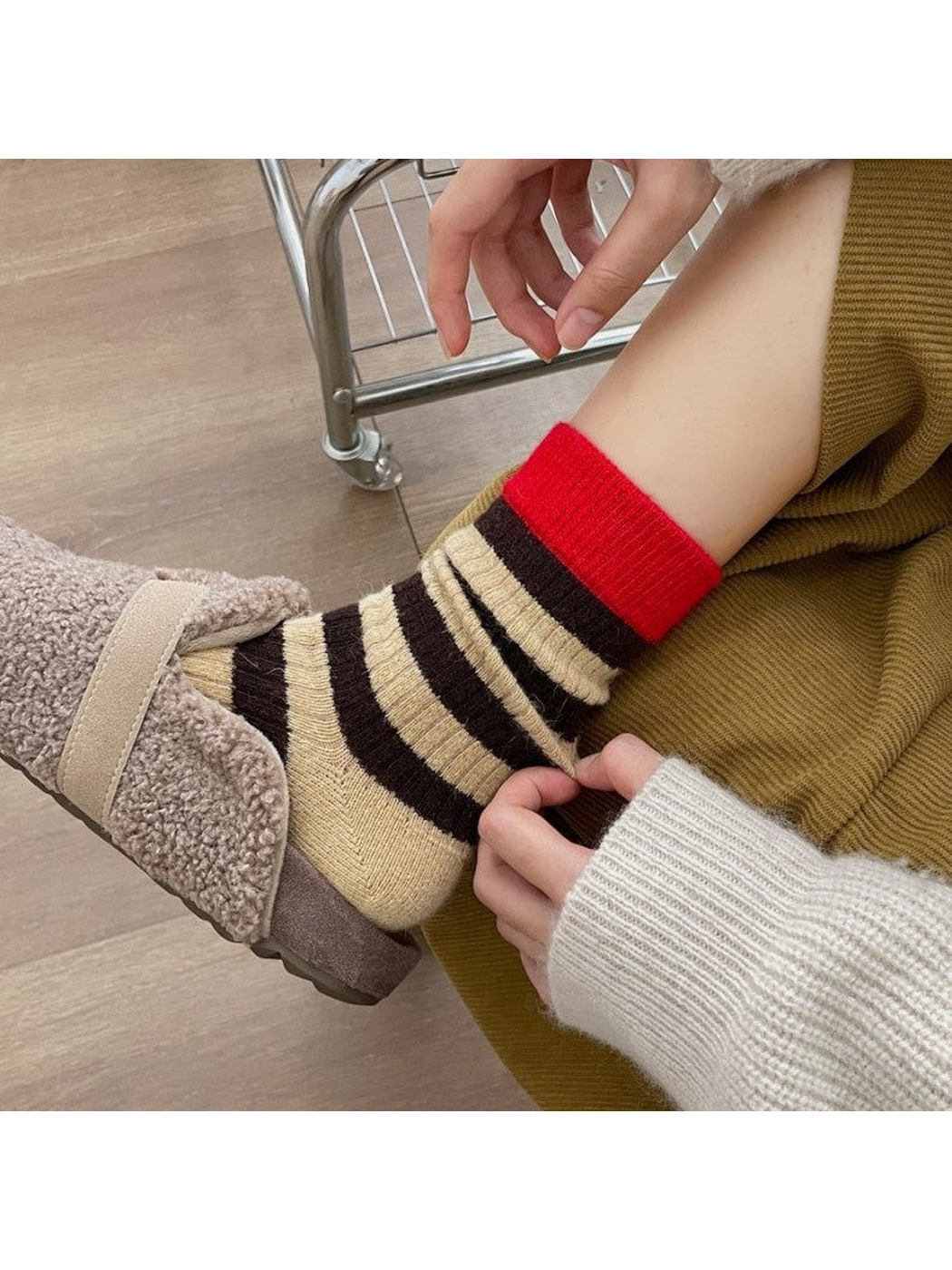 Close view of Brown striped crew socks worn with a textured shoe
