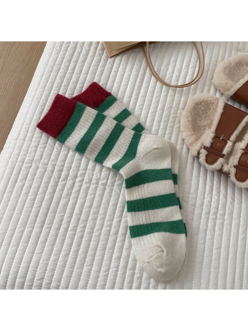 Green striped crew socks with burgundy cuffs