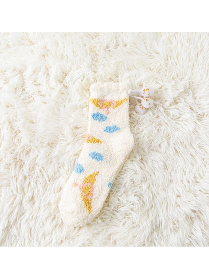 Ivory fuzzy crew sock with winged heart and blue oval motifs