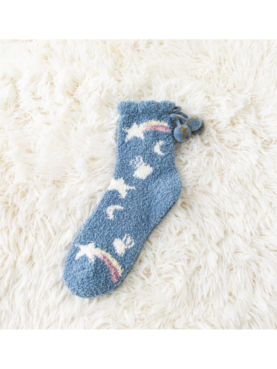 Blue fuzzy crew sock with rainbow, cloud, moon and star motifs