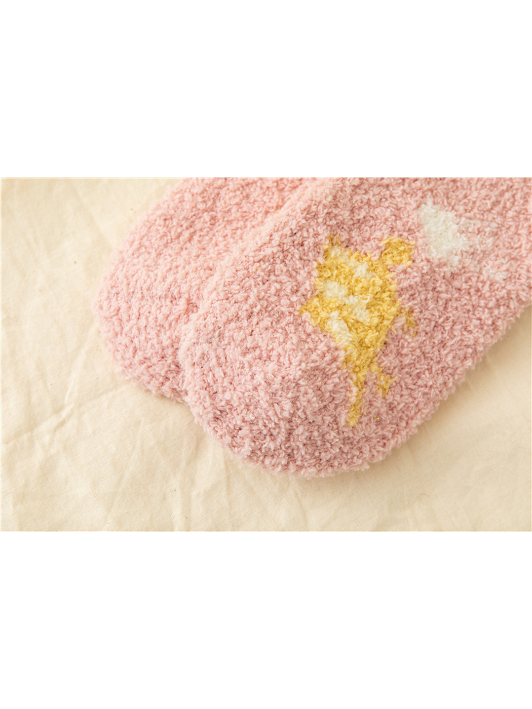 Close-up of the fuzzy looped texture and candy motif on a Light Pink sock