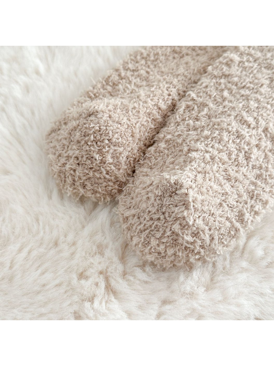Close-up of rounded sock toes with a dense fuzzy surface