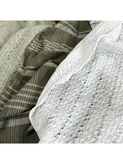 Close-up of the plaid fabric and contrasting openwork texture