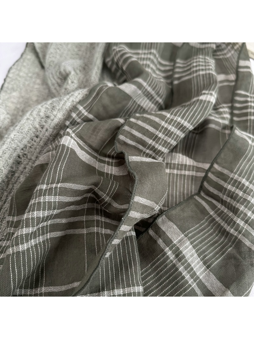 Close-up of the Army Green plaid pattern and finished edge
