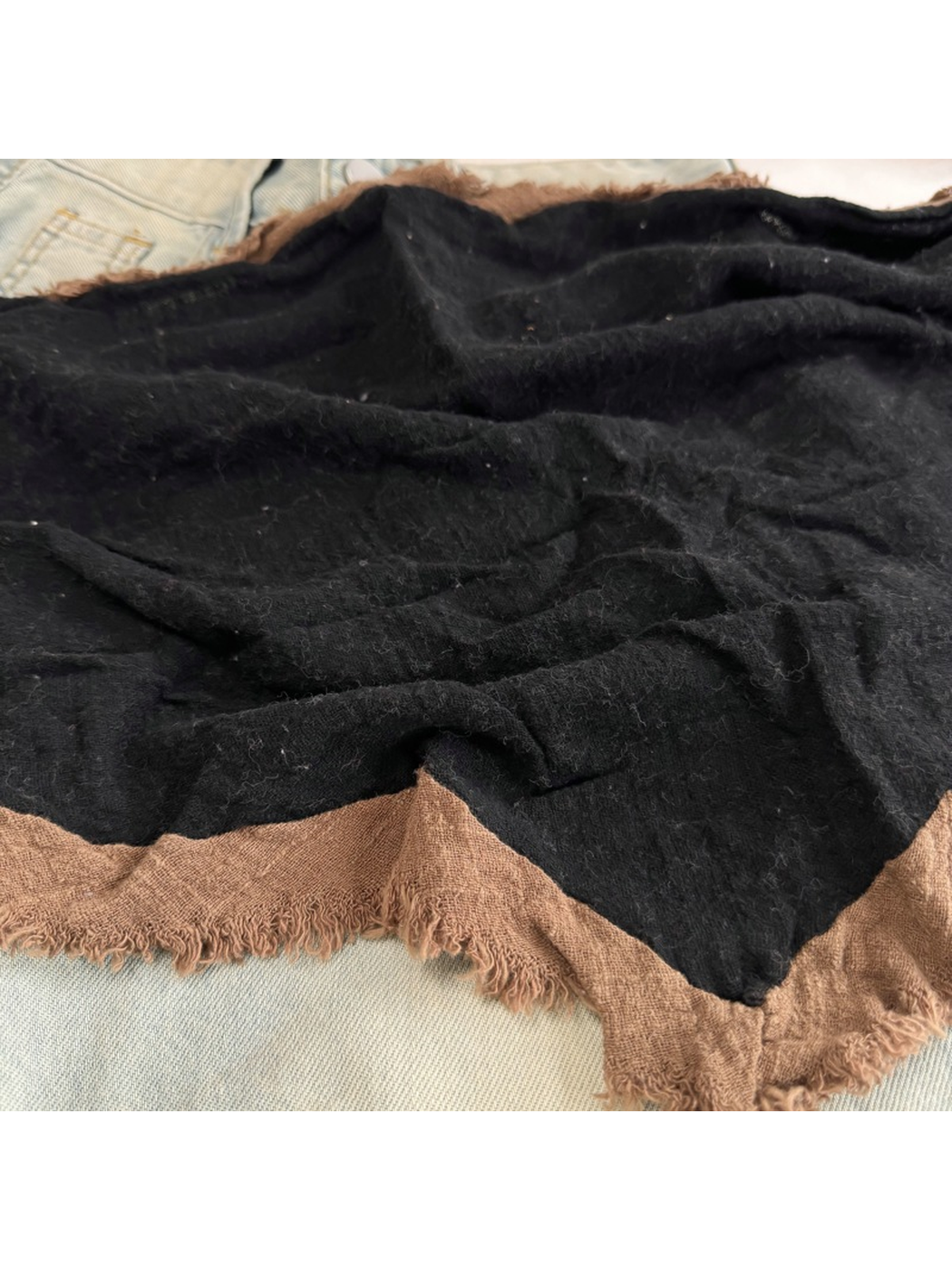 Close-up of the Black Brown scarf surface and fringed border
