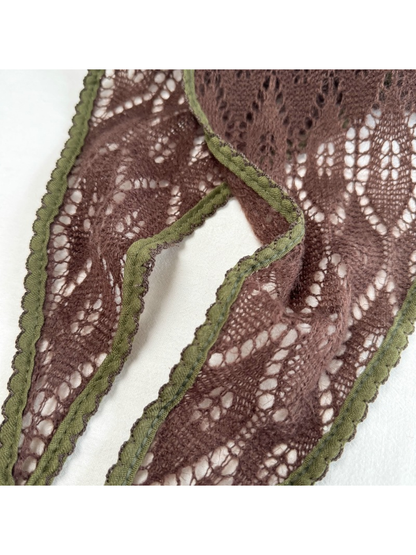 Close-up of Dark Brown openwork pattern and olive scalloped trim