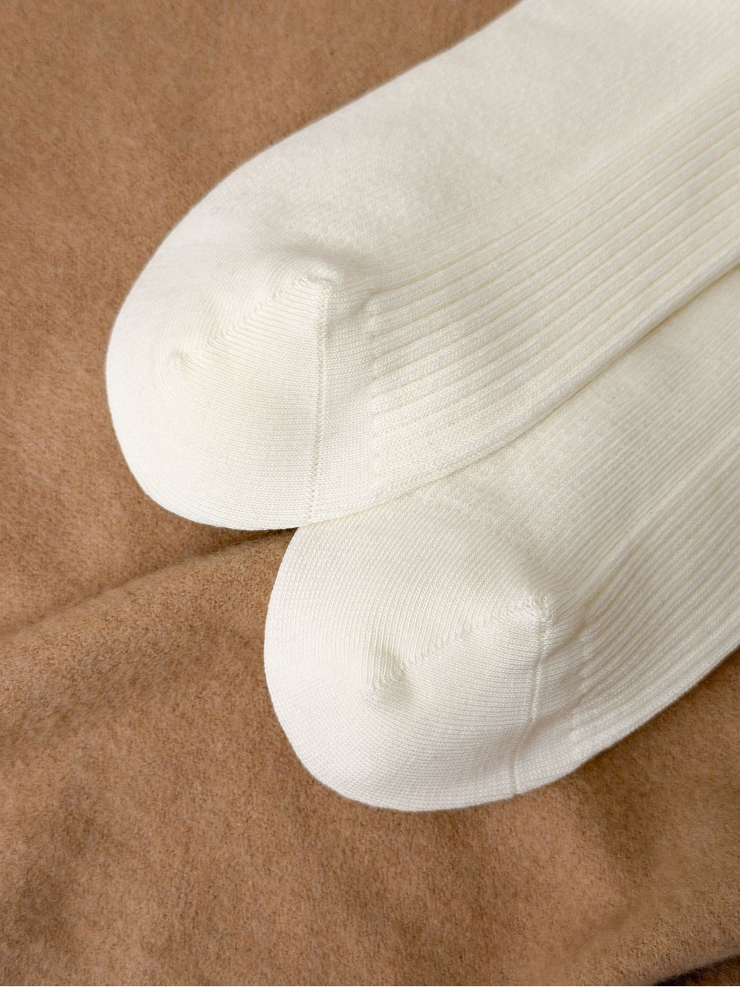Close-up of Ivory sock toe seams and fine ribbing