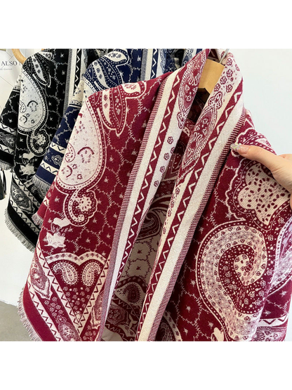 Close-up of the paisley pattern, geometric border and short fringe