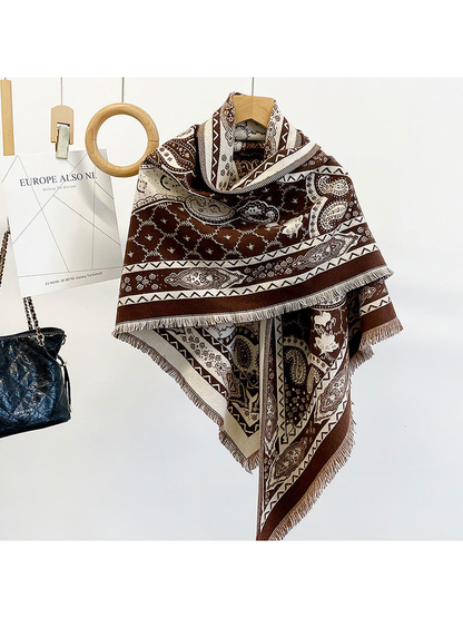 Coffee paisley triangle scarf draped on a hanger