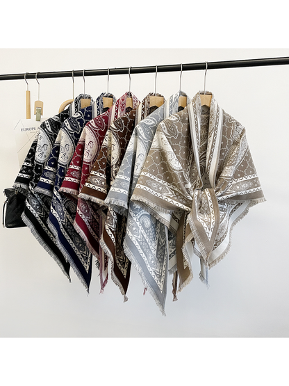 Six paisley triangle scarf colors displayed together on hangers
