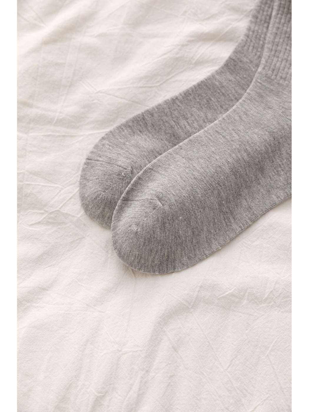 Close-up of gray sock toes with visible seams