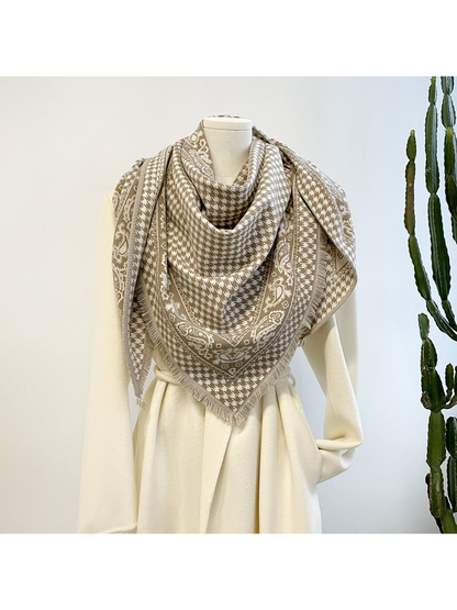 Khaki houndstooth and paisley scarf wrapped around a dress form