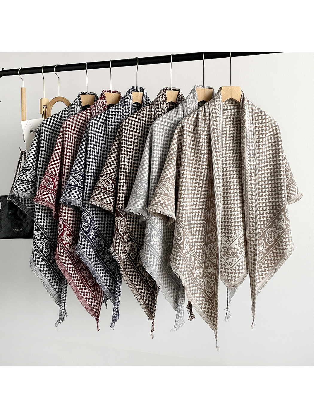 Khaki, gray, brown, navy, black and burgundy scarves displayed together