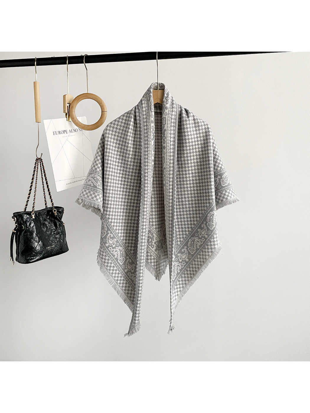 Gray houndstooth and paisley triangle scarf with fringed edges
