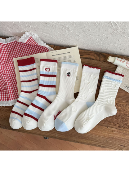 Five white crew sock styles with red and light blue details displayed together