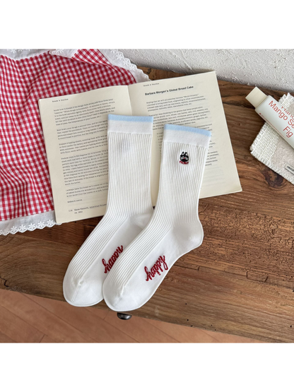 Cat style white ribbed crew socks with light blue cuffs and embroidered cat motif