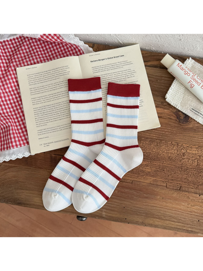 Stripes style crew socks with alternating red and light blue bands