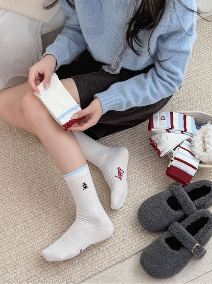 Close-up of ribbed, striped and raised-motif crew sock styles