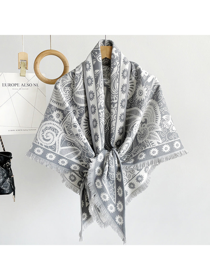 Gray paisley triangle scarf draped on a hanger