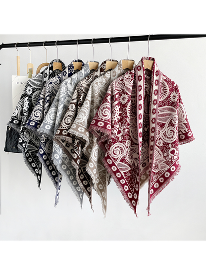 Six paisley triangle scarf colors displayed together on hangers