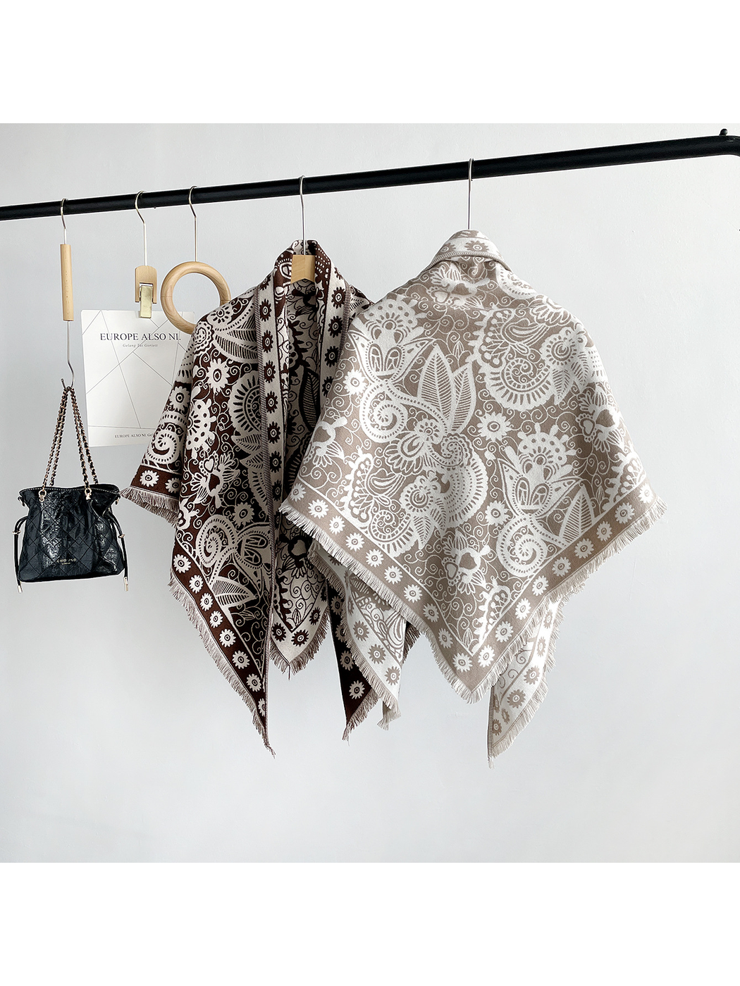 Brown and khaki paisley triangle scarves showing contrasting front and reverse patterns