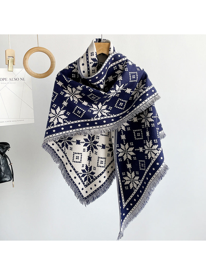 Navy snowflake triangle scarf draped on a hanger