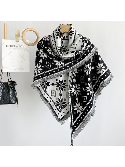 Black snowflake triangle scarf draped on a hanger