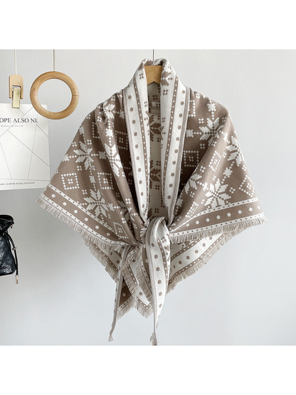 Khaki snowflake triangle scarf tied on a hanger