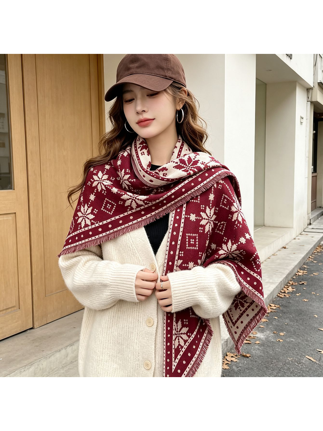 Burgundy snowflake scarf styled over a cream cardigan outdoors