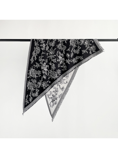 Black and ivory floral triangle scarf with striped border and short fringe