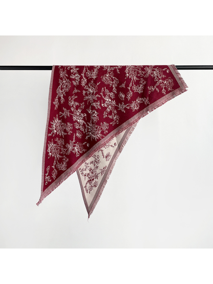 Burgundy floral triangle scarf with striped border and short fringe