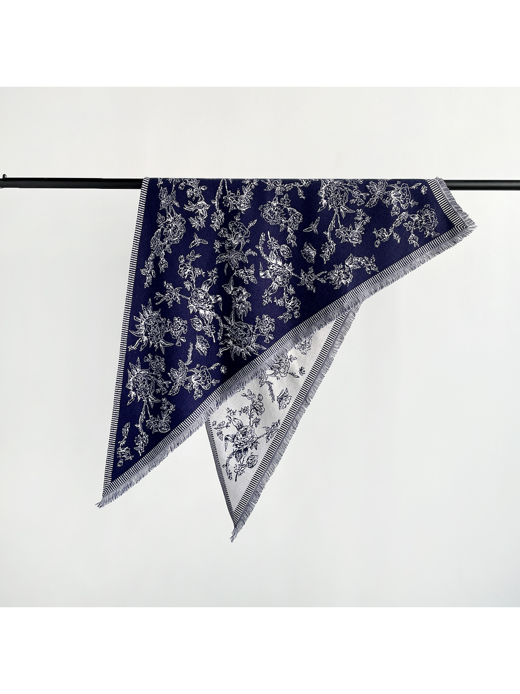 Navy floral triangle scarf with striped border and short fringe