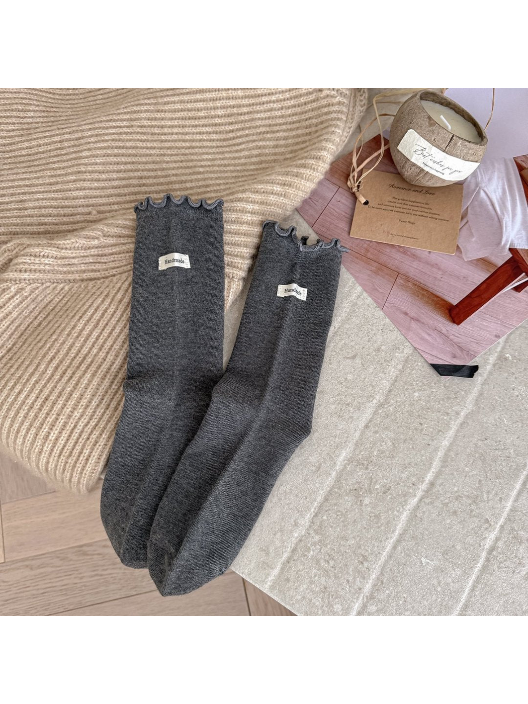 Dark Gray crew socks with ruffle cuffs and small fabric labels