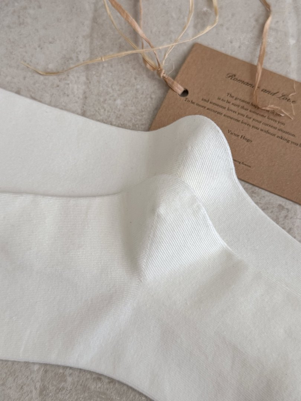 Close-up of the fine vertical ribbed texture on White socks
