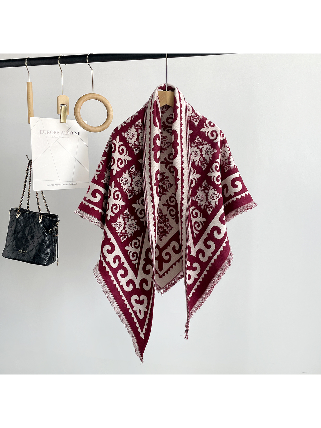 Burgundy patterned triangle scarf with short fringe, front view