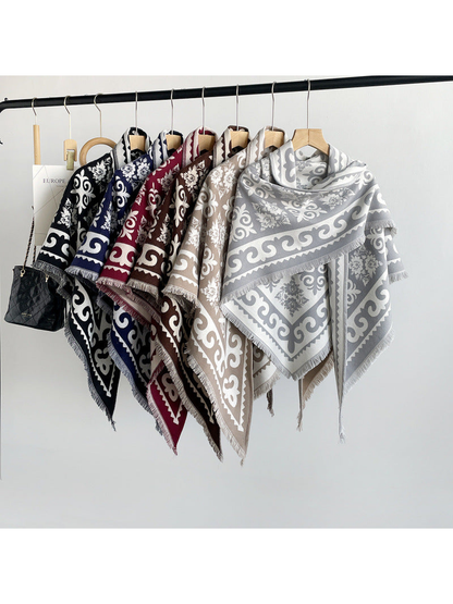 Six color variations of the patterned triangle scarf displayed together