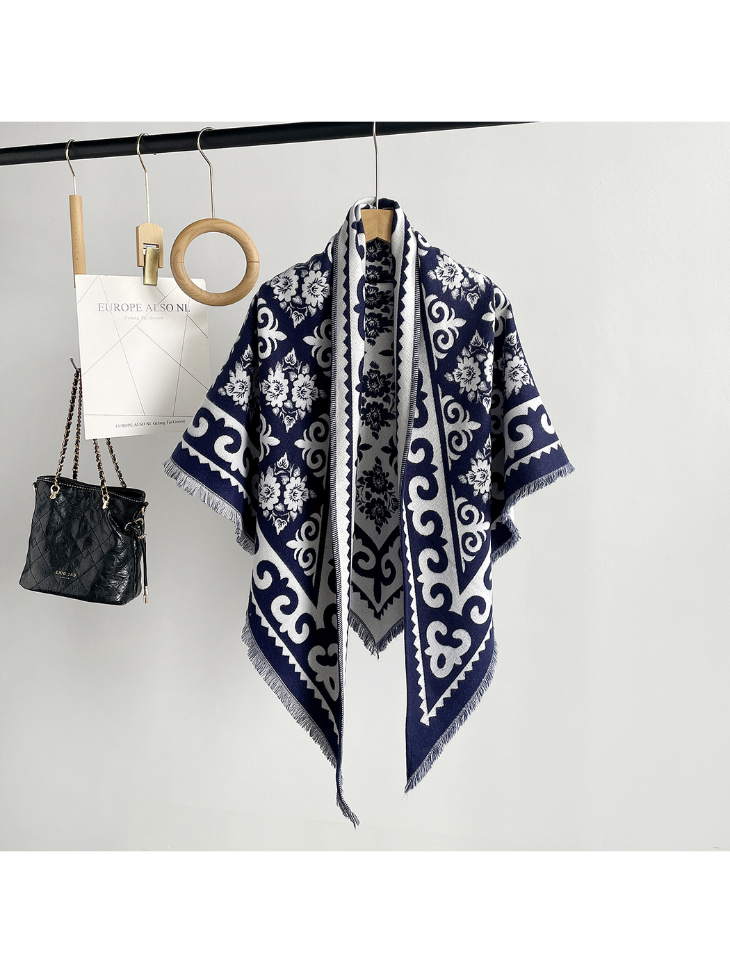 Navy patterned triangle scarf with short fringe, front view