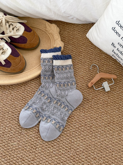 Light Gray patterned crew socks with ivory cuffs and navy ruffled edges