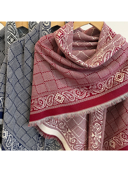 Close-up of Burgundy and Navy scarves with geometric fields, paisley borders and short fringe