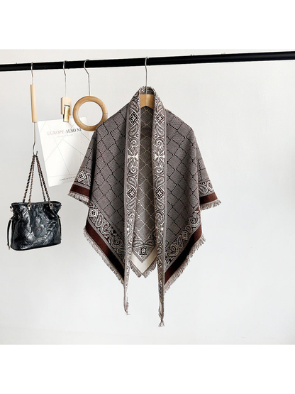 Coffee geometric scarf with paisley border and short fringe displayed on a hanger
