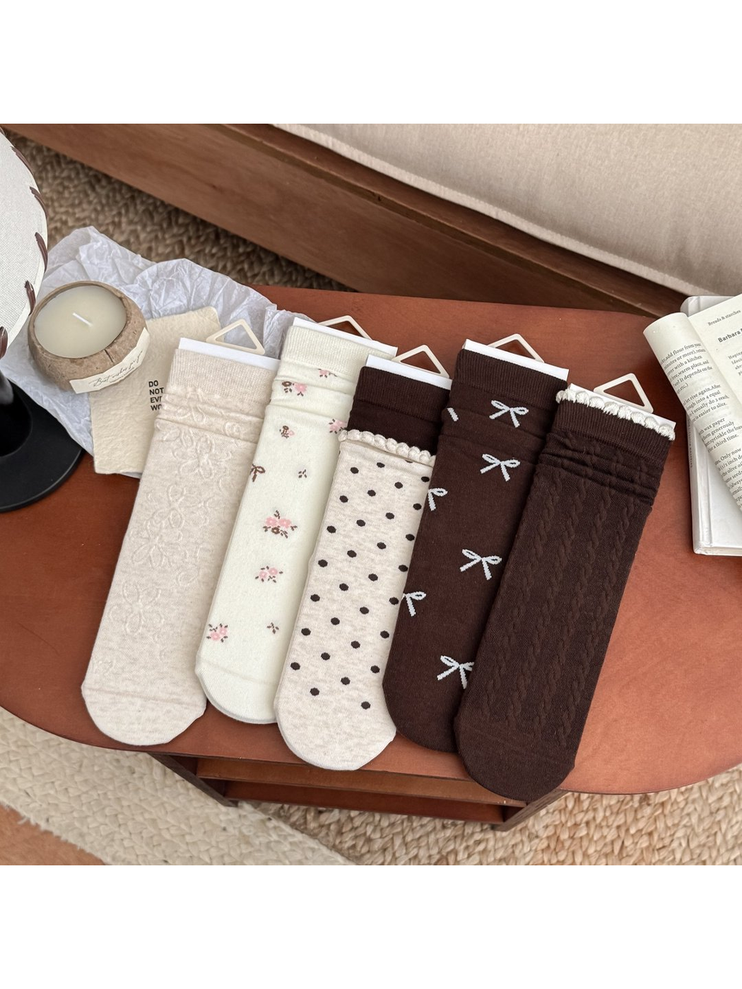 Five crew sock styles with bow, floral, polka-dot and cable designs
