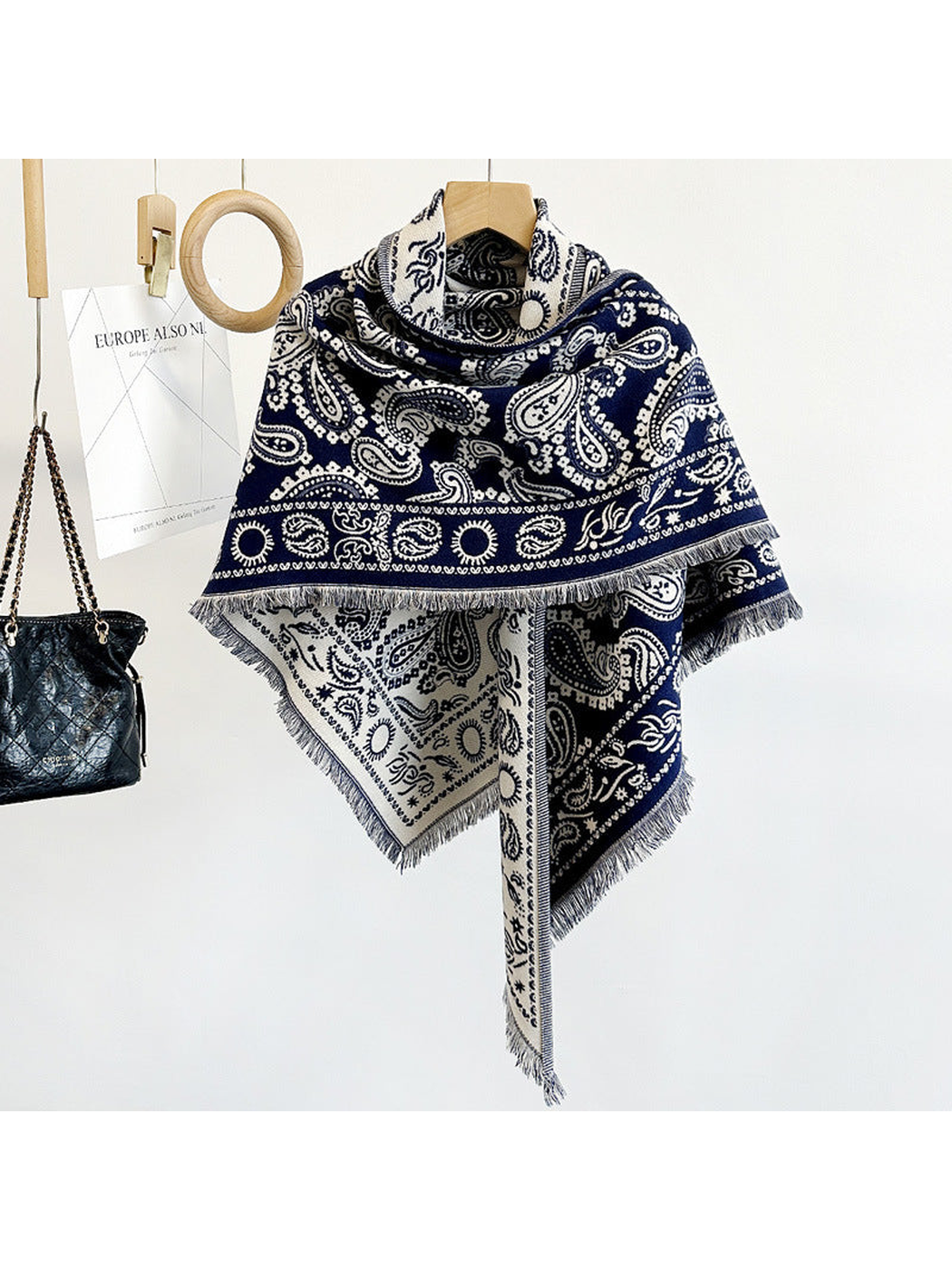 Navy paisley triangle scarf with short fringe, hanging view