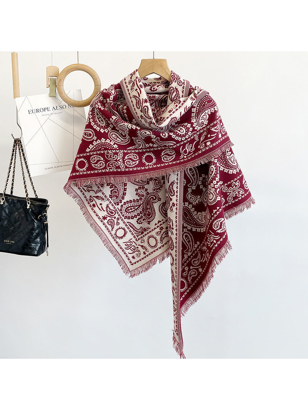 Burgundy paisley triangle scarf with short fringe, hanging view