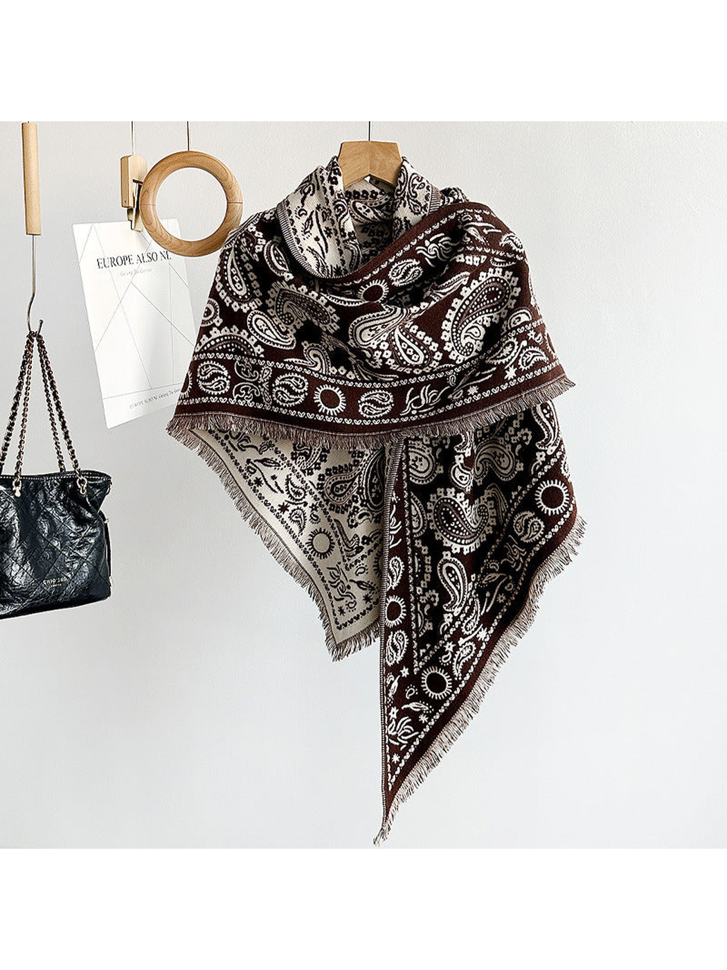 Coffee paisley triangle scarf with short fringe, hanging view