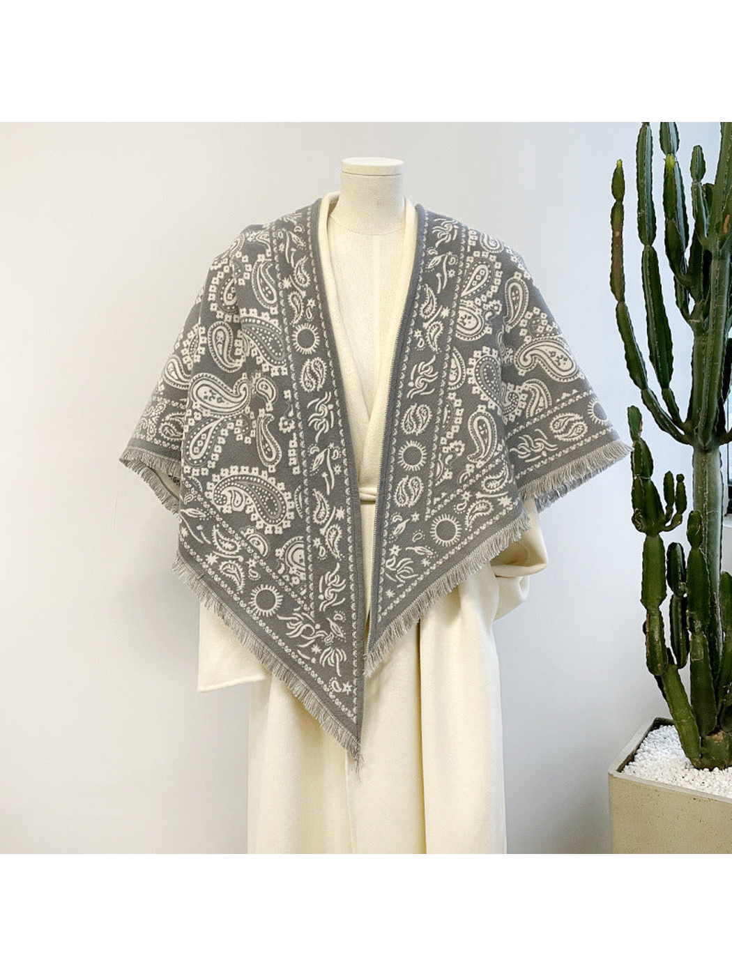 Gray paisley triangle scarf with short fringe, mannequin view
