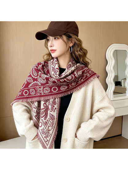 Burgundy paisley triangle scarf worn over a white cardigan