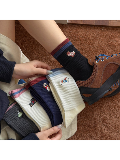 Animal motif crew socks styled with a brown sneaker
