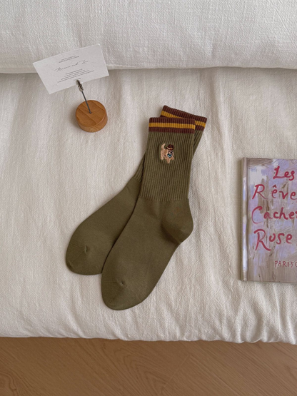 Cowboy Dog olive green crew socks with striped cuffs