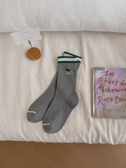 Teacup Cat gray crew socks with green and white striped cuffs