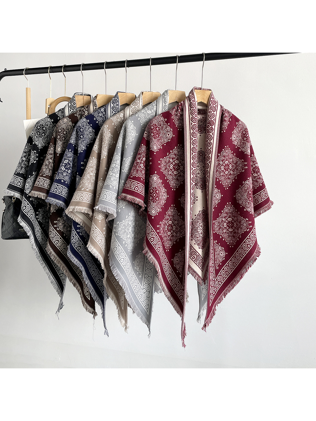 Six color variations of the medallion-pattern triangle scarf displayed together